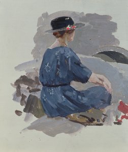 Mujer con vestido azul y sombrero de ala ancha sentada sobre rocas